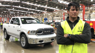 Fernando Carvajal with a Ram pick-up truck at the Clayton car assembly line.