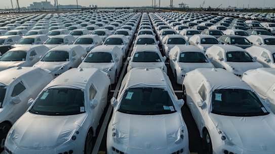 Chinese cars and other export goods are flooding global markets. But it’s not all good news for its economy.
