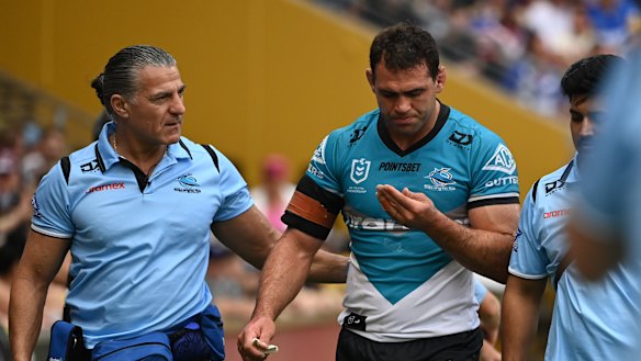 Dale Finucane heads for the sheds after another head knock.