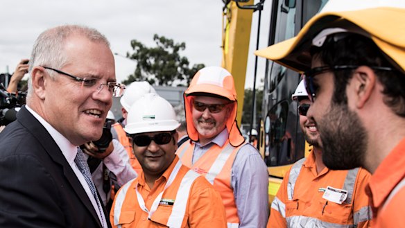 Hammer blows ... Scott Morrison on the campaign trail at the Mulgoa Road Corridor in Penrith on Friday.