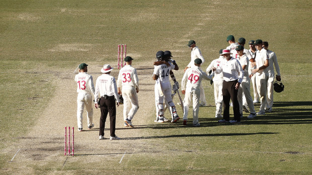 Ravi Ashwin and Hanuma Vihari celebrate after securing a draw in the third Test at the SCG.