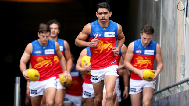Charlie Cameron leads out the Lions during their impressive win over Port Adelaide on Sunday.