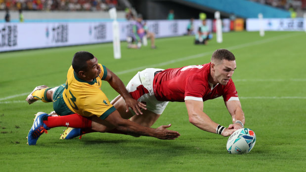 Wales' George North beats Australia's Kurtley Beale to the ball on Sunday night. 