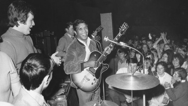 
Lionel Rose performs at a pop concert at the Melbourne Velodrome. Johnny Young is on the left. December 12, 1969