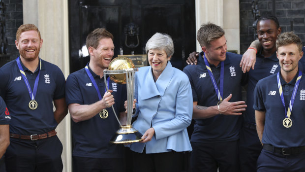Britain's Prime Minister Theresa May with members of the World Cup winning England cricket team.