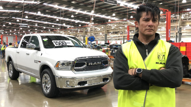 Fernando Carvajal with a Ram pick-up truck at the Clayton car assembly line.