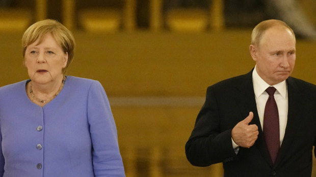 Russian President Vladimir Putin, right, and German Chancellor Angela Merkel.