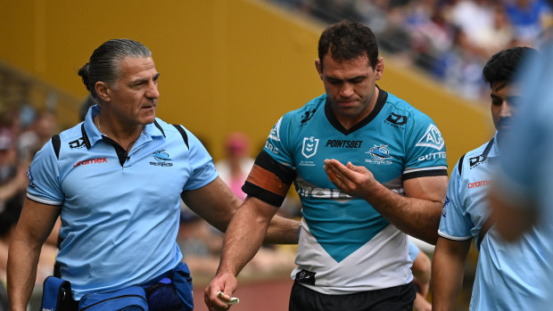 Dale Finucane heads for the sheds after another head knock.