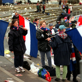 The crowd sticks around after the match to celebrate the win.
