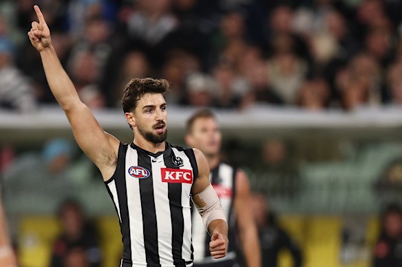 Josh Daicos of the Magpies celebrates a goal.