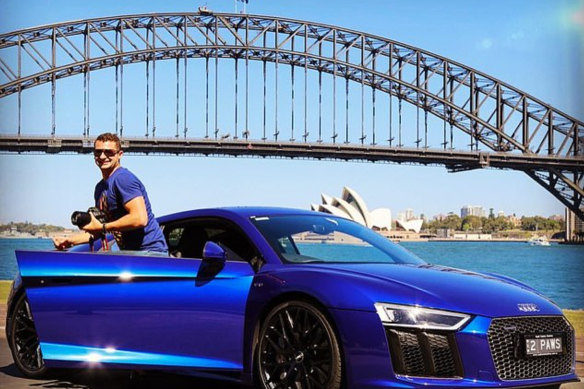 Melissa Caddick’s husband Anthony Koletti with the 2016 Audi R8 V10, which was recently sold by liquidators.