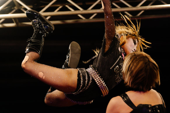 Atomic Banshee jumps over Countless Saori during the Sukeban match in Miami.