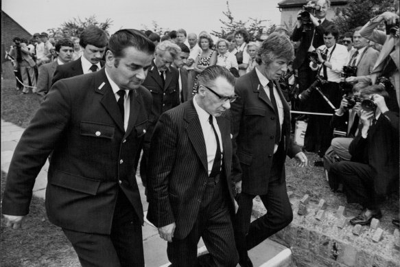 Ronnie Kray arrives handcuffed at the church. August 11, 1982.