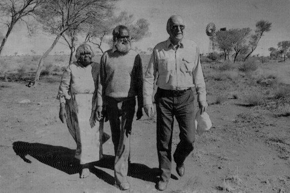 Royal commissioner James McClelland (right) at a campsite at Wallatinna station where elder Kanytji (centre) viewed the fallout cloud of the Totem 1 test at Emu field in 1953.