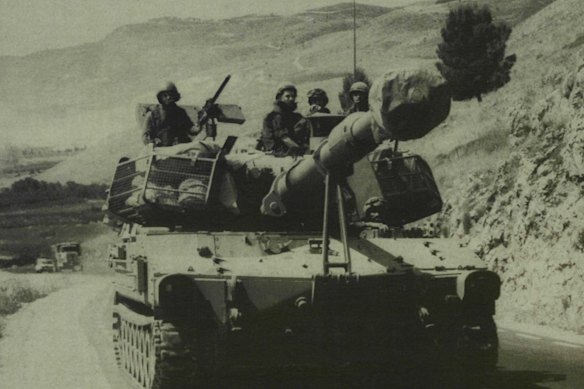 An Israeli self-propelled gun moves along a road in Lebanon’s Bekka Valley in 1983.