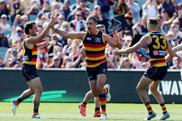 Taylor Walker celebrates one of his five goals in the win.