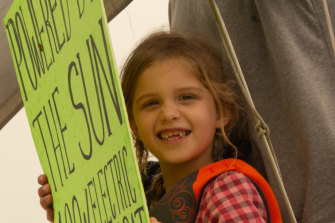 Lila Hart, 6, on the solar-powered boat in New York Harbour.