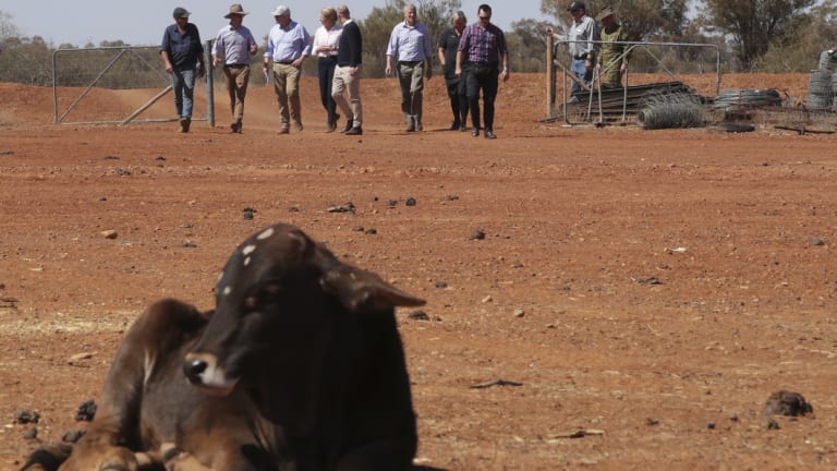 Agriculture Minister David Littleproud (left), with grazier Stephen Tully, Prime Minister Scott Morrison and Deputy Nationals leader Bridget McKenzie at the Tully property in Quilpie during a visit to the Queensland outback on Monday.