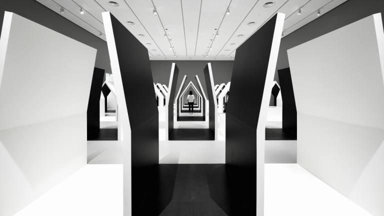 Oki Sato's design enhances the experience of viewing Escher's works.