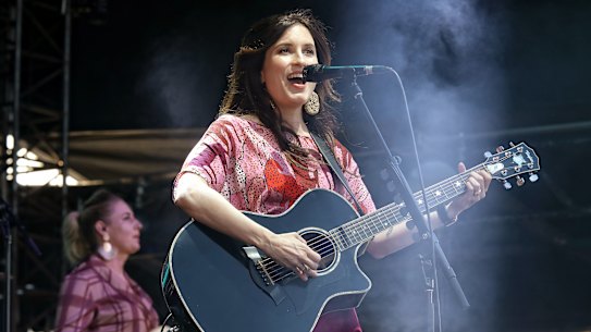 Missy Higgins performing in the forecourt at the Sydney Opera House.