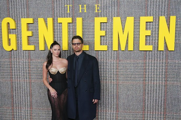 Actors Kaya Scodelario and Theo James pose for photos at the premiere of the Netflix series "The Gentlemen", at the Theatre Royal Drury Lane, in London, Tuesday March 5, 2024. 