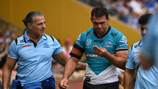 Dale Finucane heads for the sheds after another head knock.