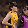 Will Day hobbles off Adelaide Oval.