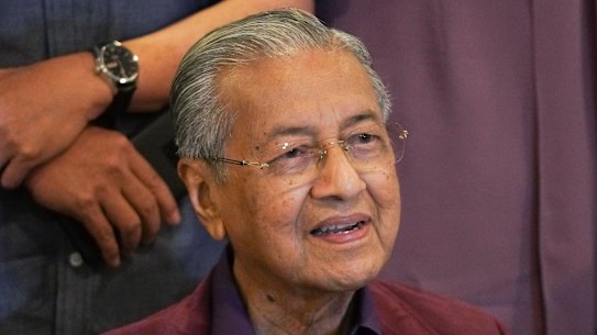 FILE - In this Feb. 22, 2020, file photo, Malaysian Prime Minister Mahathir Mohamad, speaks during a press conference in Putrajaya, Malaysia.  Malaysia's alliance government under 94-year-old Prime Minister Mahathir is threatening to unravel less than two years after a historic election victory ousting the coalition that had ruled the country since independence.(AP Photo/Vincent Thian)