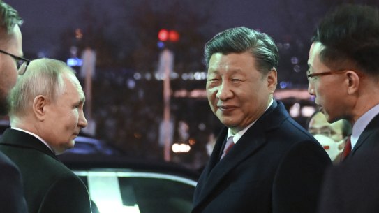 Chinese President Xi Jinping, right, and Russian President Vladimir Putin talk to each other prior to Chinese President Xi Jinping leaving after their dinner at The Palace of the Facets in the Moscow Kremlin, Russia.