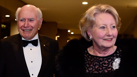 John and Janette Howard arrive at the club for his 80th birthday party on July 26.