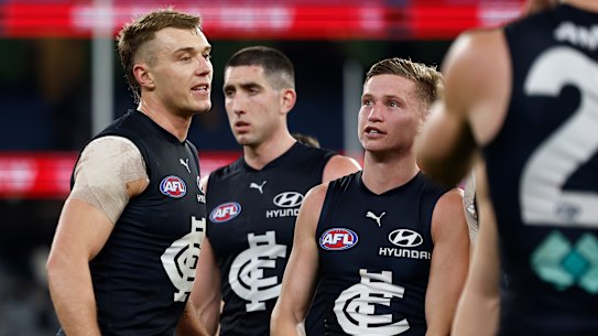 A dejected Carlton trudge off the MCG after their loss to Collingwood.