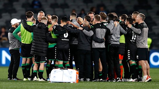 Mark Rudan speaks to his players after the semi-final loss to Melbourne City.