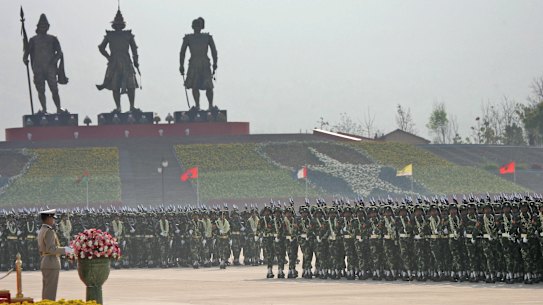 Myanmar soldiers pass in review during the Armed Forces Day ceremony in the new capital of Naypyitaw in 2007, the first time Western journalists were allowed to view the new city.