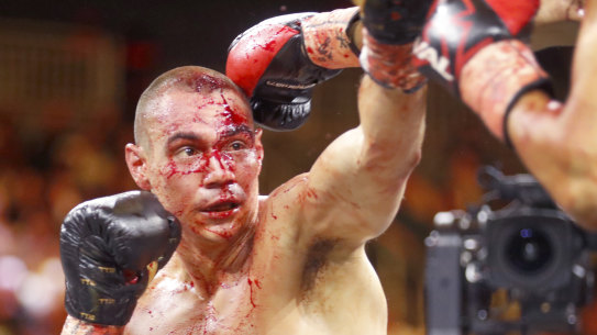 Bloody mess: Tim Tszyu (left) in the third round of his bout against Sebastian Fundora in Las Vegas.