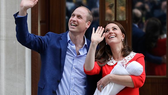Prince William and Kate, Duchess of Cambridge, hold their newborn son outside St Mary's Hospital/.