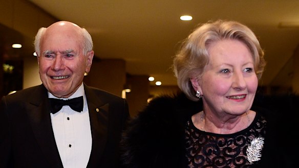 John and Janette Howard arrive at the club for his 80th birthday party on July 26.