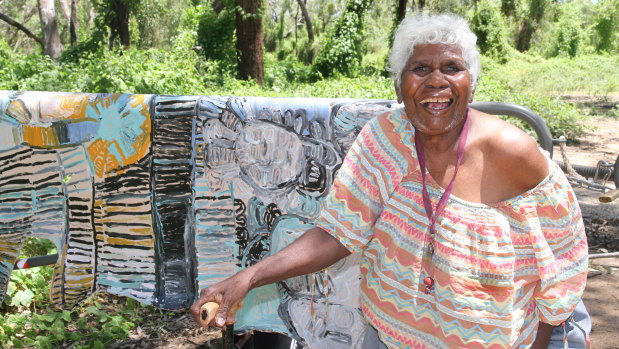 Sonia Kurarra at Danggu Geikie Gorge with artwork "Noonkanbah Highway". 