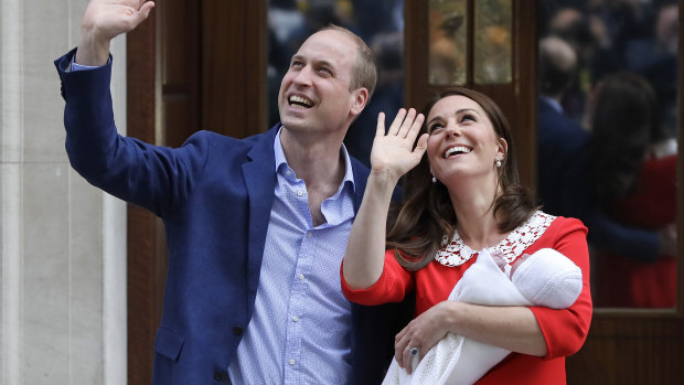 Prince William and Kate, Duchess of Cambridge, hold their newborn son outside St Mary's Hospital/.