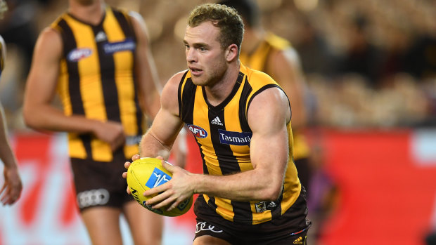 On the ball: Tom Mitchell in action for Hawthorn.