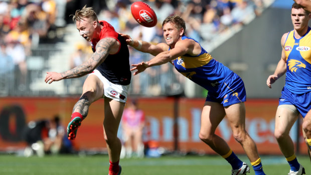 Kicking on: James Harmes goes forward under pressure during the Melbourne's win over West Coast.