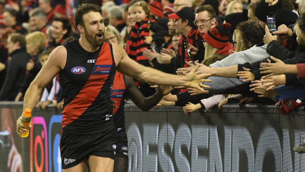 Matchwinner Cale Hooker celebrates with fans after the win over the Giants.