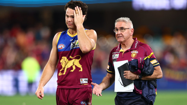 Cam Rayner and Chris Fagan leave the field after the Brisbane Lions’ clash with Melbourne.