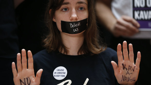 A protester displays a note on her hands that reads "No Kavanaugh" while demonstrating ahead of a Senate Judiciary Committee hearing in Washington DC this week.
