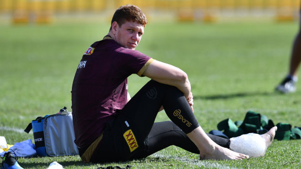 Ayia Napa: Dylan Napa rests with ice on his ankle during Maroons training on Wednesday.