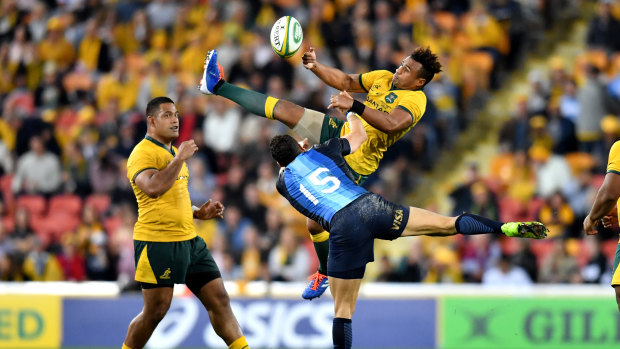 Will Genia of the Wallabies flies for the ball over Joaquin Tuculet in a Rugby Championship match last year. 