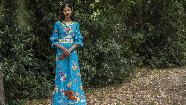 A model wears a Gorman dress that features the art of the artist, the late Mirka Mora at the parade at Heide Museum of Modern Art on Sunday.