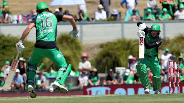 Stoinis hurdles a drive from Ben Dunk.