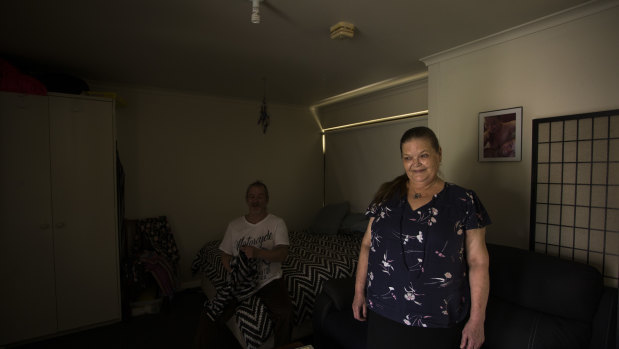 Kathy Watts and her partner Tom inside her new Coburg home, which she describes as her "mini palace".
