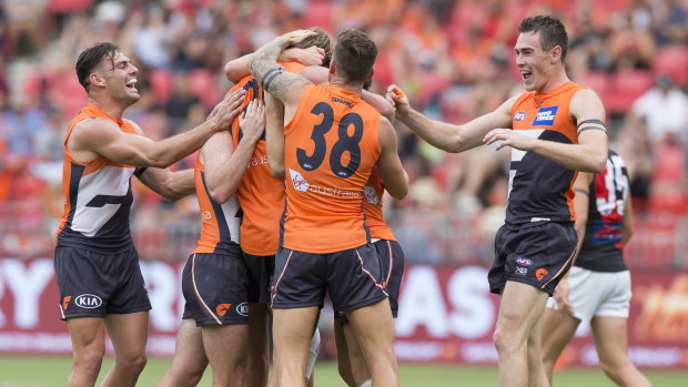 Giants celebrate a Lachlan Keeffe goal on Sunday against Essendon.