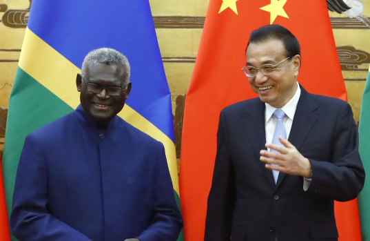 Solomon Islands Prime Minister Manasseh Sogavare with Chinese Premier Li Keqiang at a ceremony at the Great Hall of the People in Beijing in October. 
